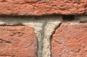 Three_old_bricks_held_together_with_mortar